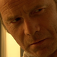 Gordon (Peter Mullan) looks concerned while wearing a hazmat suit.